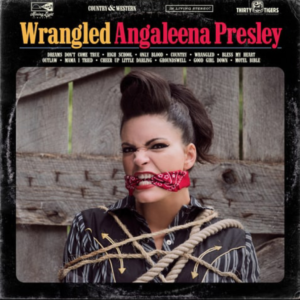 Wrangled Cover--she's tied up with a bandana between her teeth, literally wrangled.