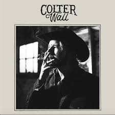 Colter Wall cover--He is smoking a cigarette in an old black-and-white setting.